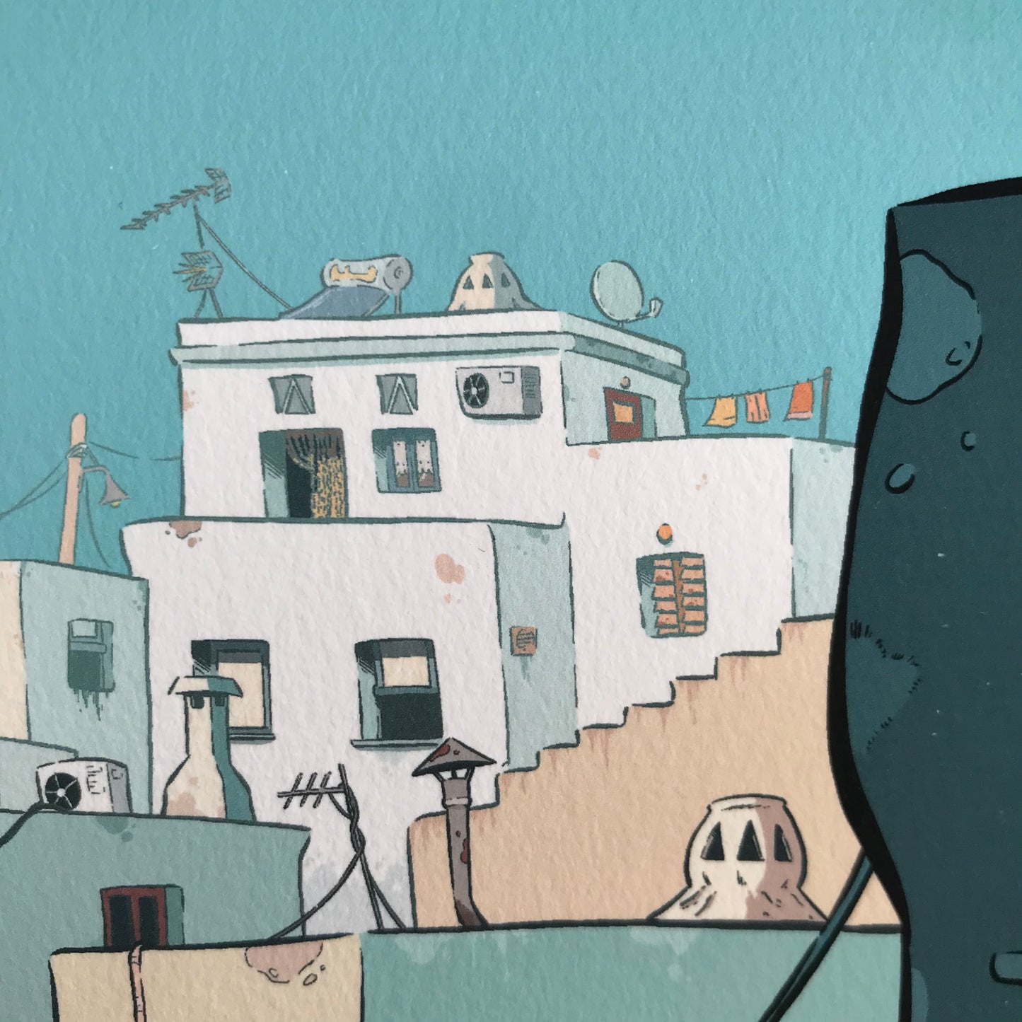 close up of one of the house. Clothes hanging, solar pannel, chimneys, stairs and street lamps are the details visible.
