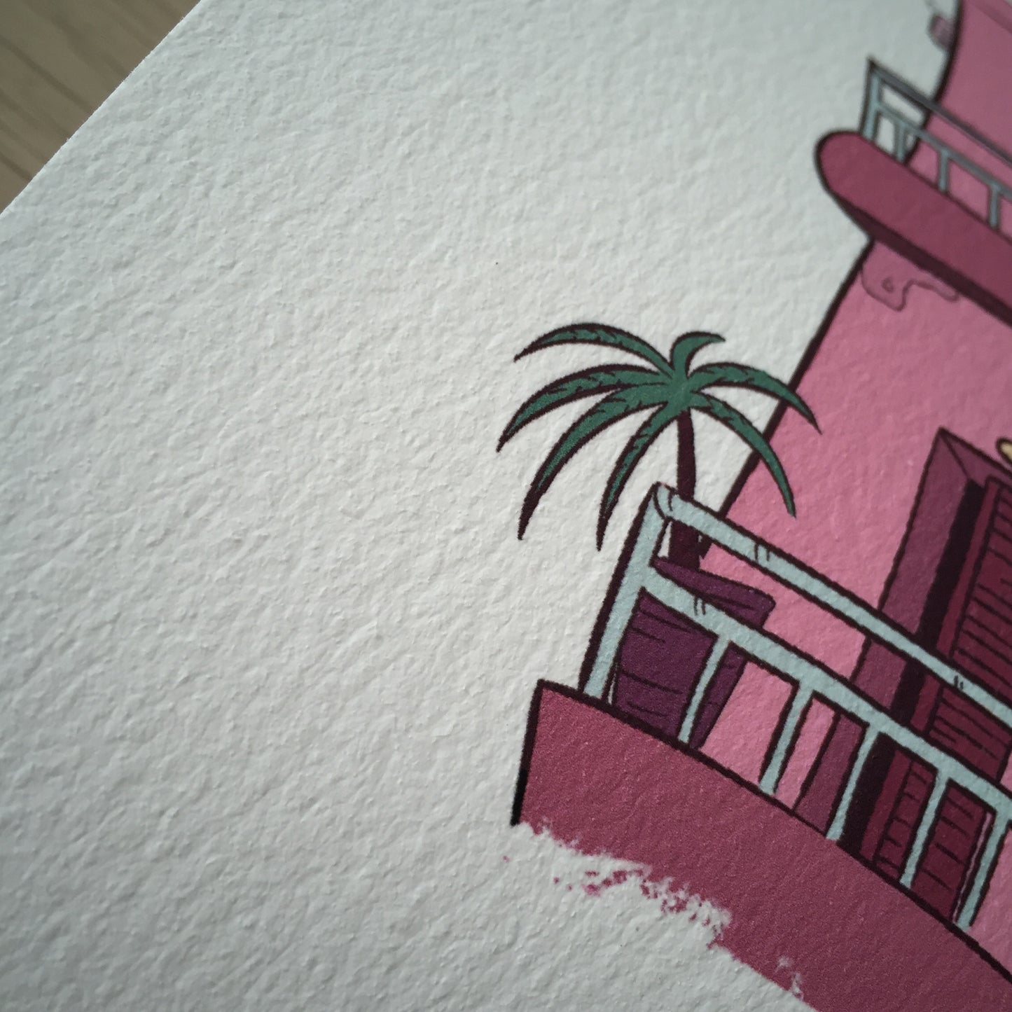 Close up of the bottom of the building. We have a small palm tree on the balcony.