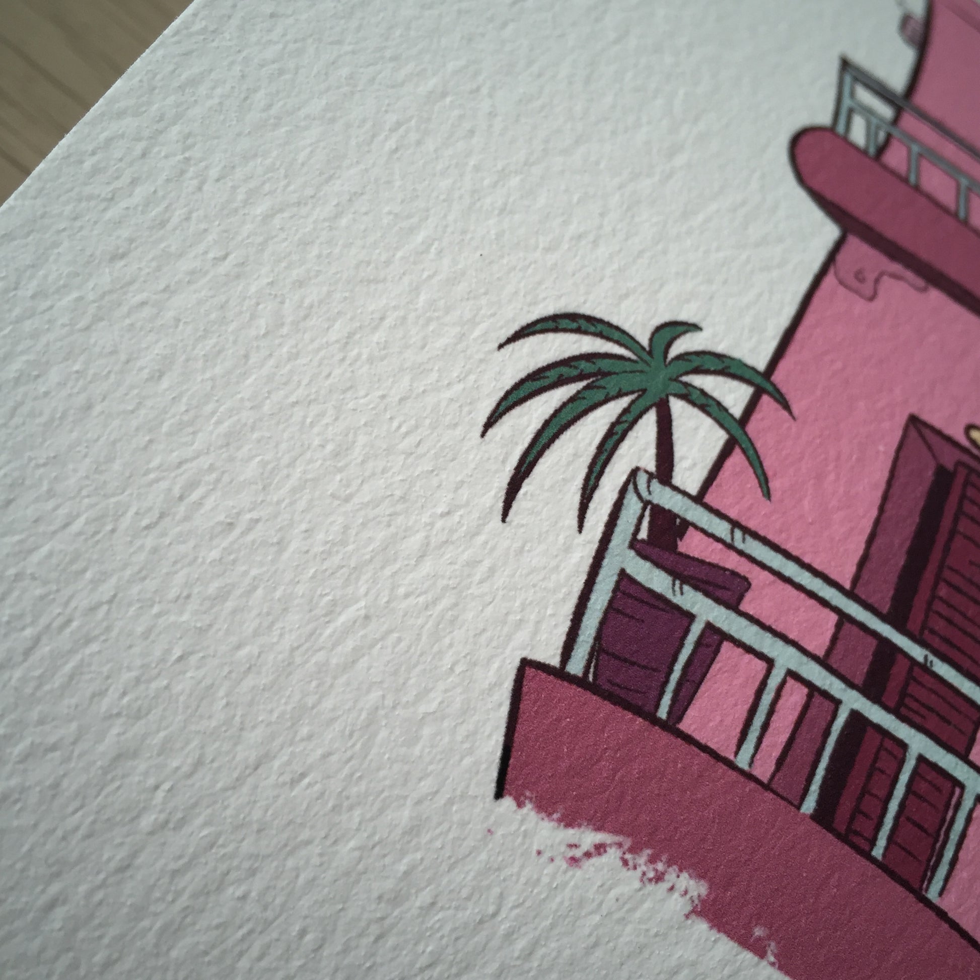 Close up of the bottom of the building. We have a small palm tree on the balcony.