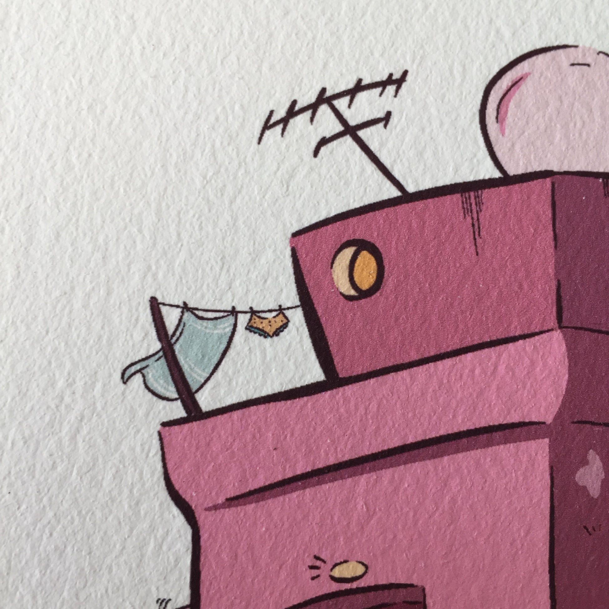 Close up of the top left corner of the building, where we can see a small round window where some light is coming out of it.