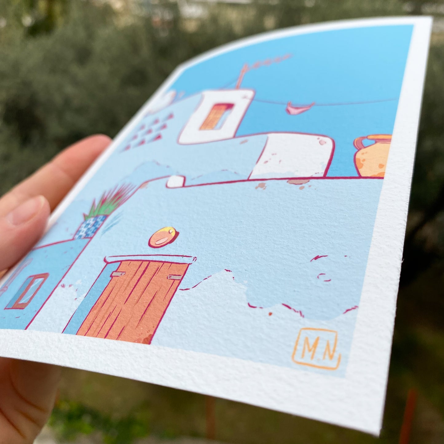 Close up of the bottom right corner of the print. We can see some details of the houses such as, a door, a lamp above the door, a vase, an underwear drying on a wire etc.
