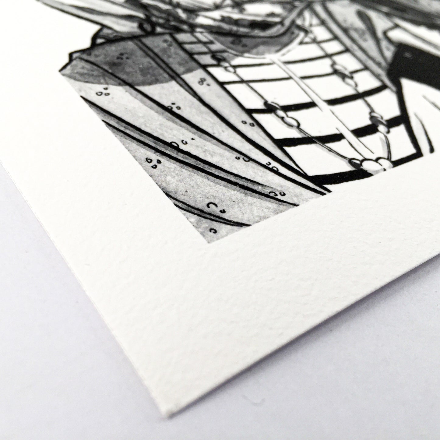 Close up of the left botton of the art print where we can see a part of the clothes of one of the lady.