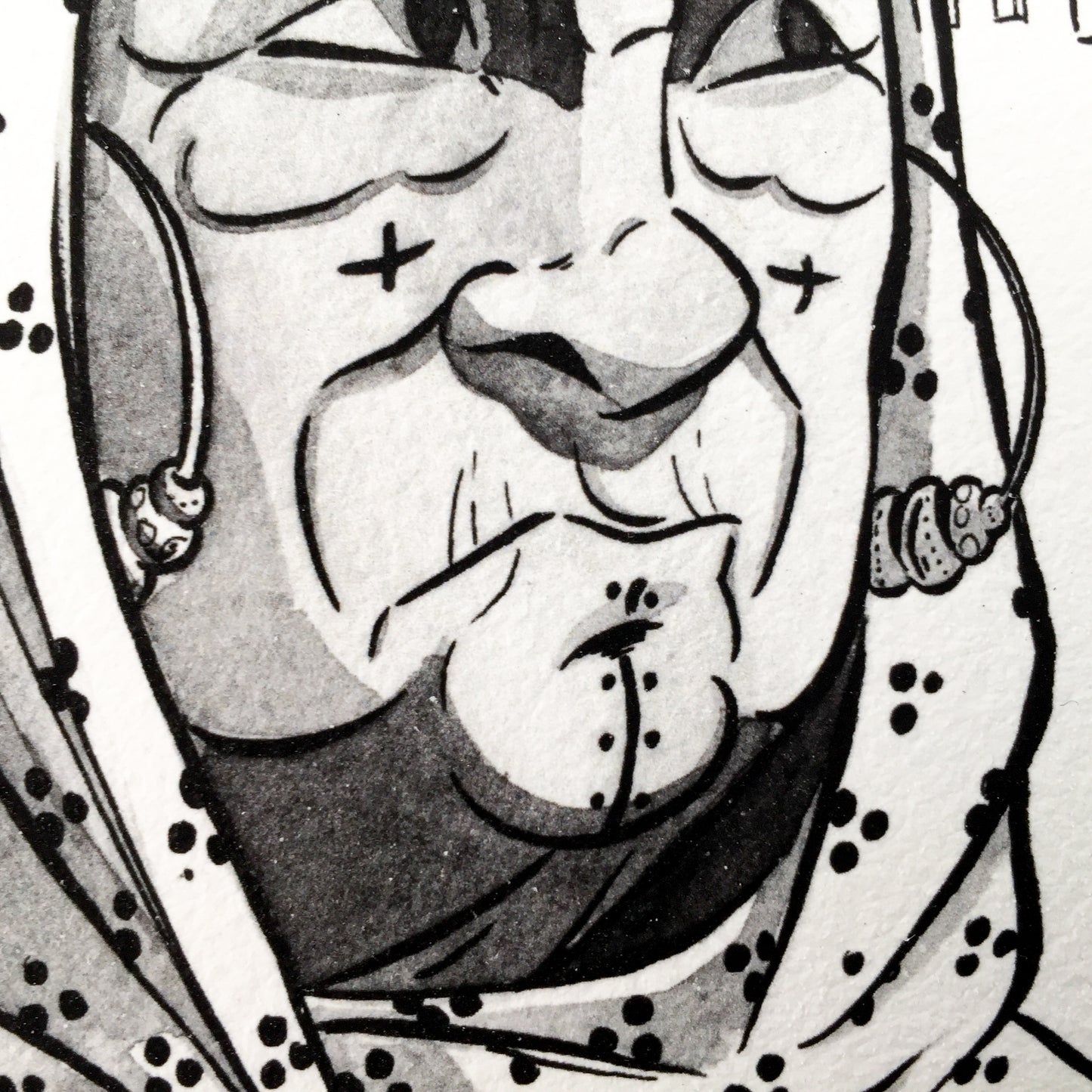 Close up of the chin of the right lady. We can alson see the pattern of the headscarf and two head decoration (like hoops earings).