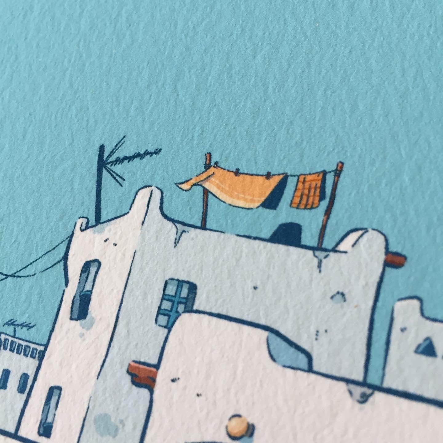 close up of one of the house. Some clothes are hanging to dry