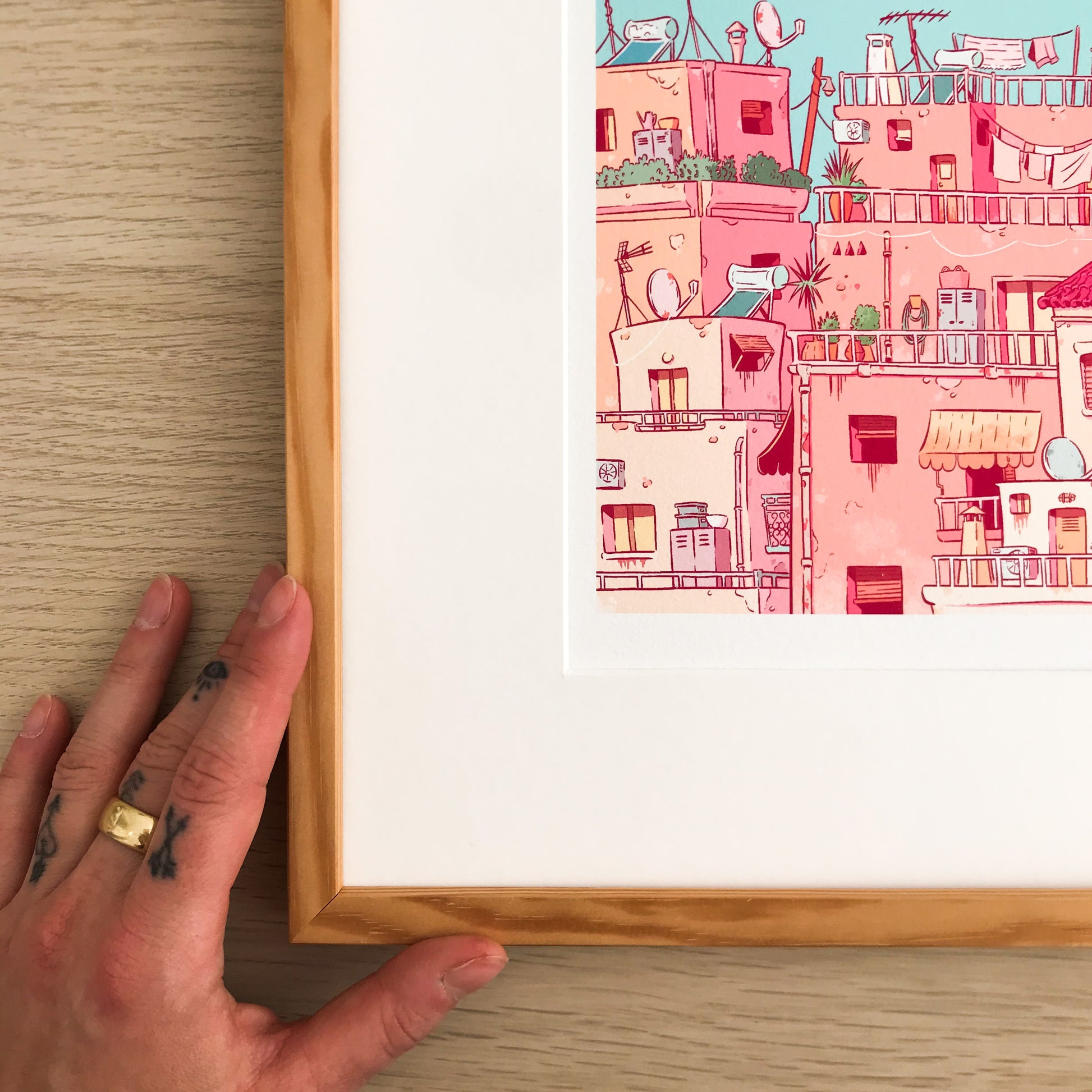 Close up of the left part of the framed  illustration. 