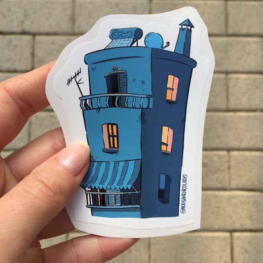 sticker of a blue building inspired by greek architecture with the balconies and the terrace, solar pannel, parabolic antenna. Some light are escaping from the windows.