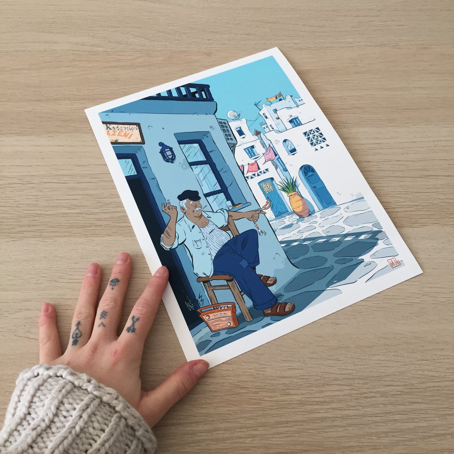 The print with a hand next to it.