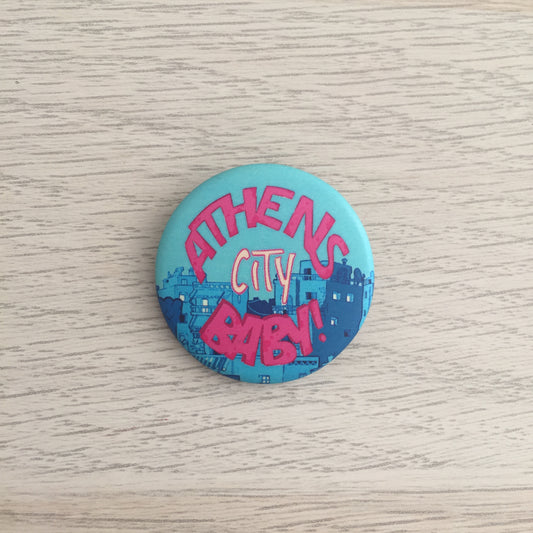 the button pins on a wooden surface