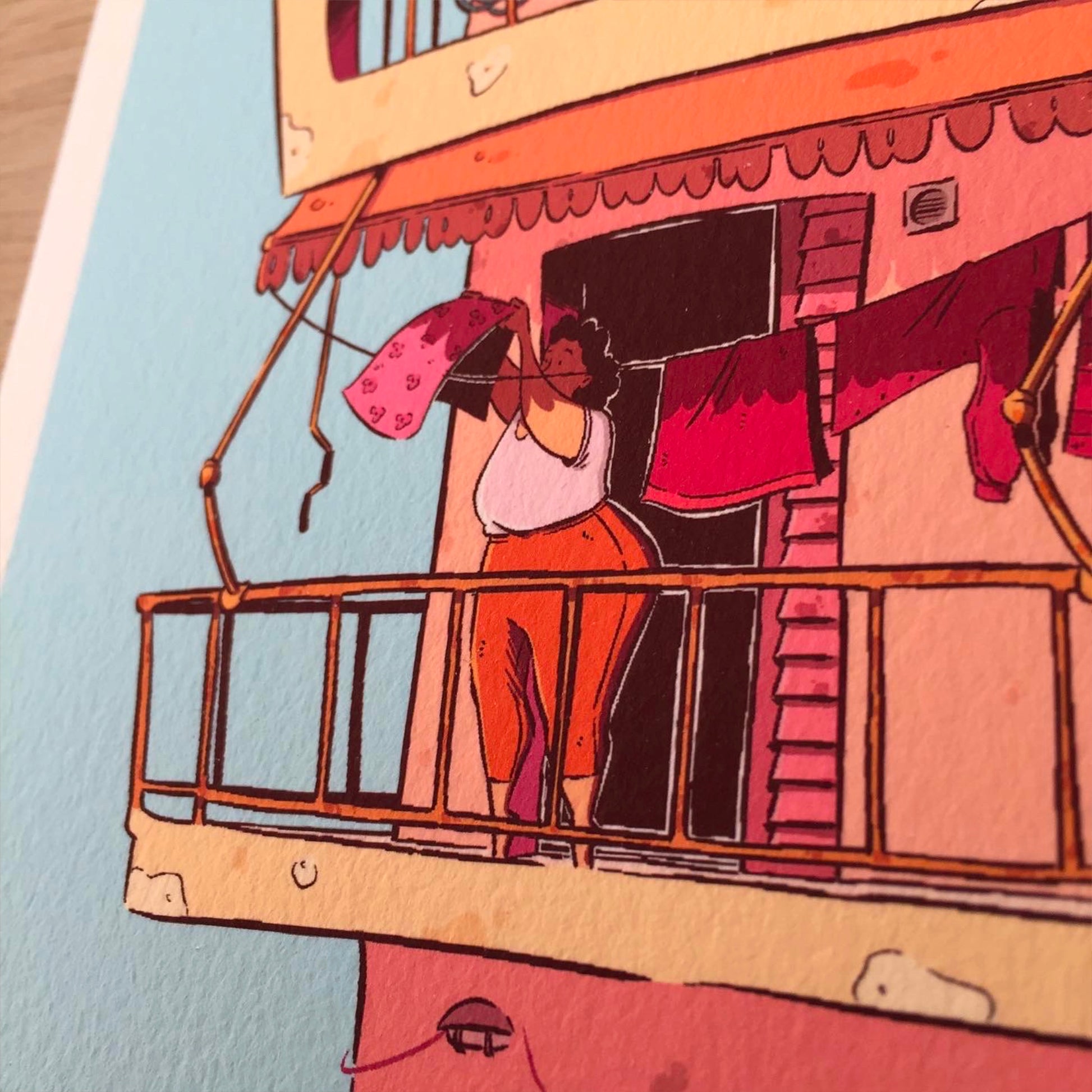 close up of the lady on the 1st floor, hanging out the laundry. 